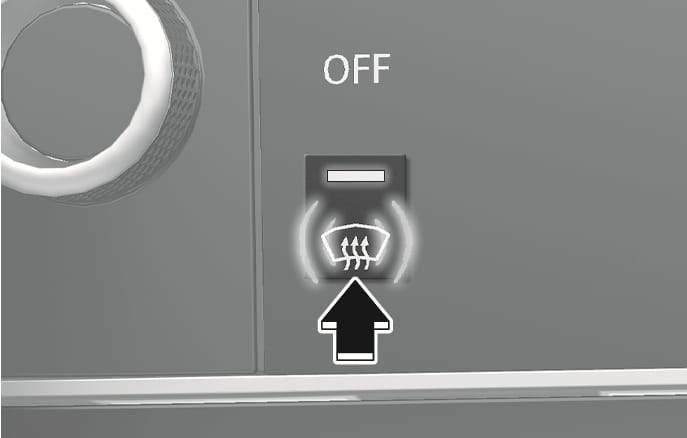 2025 Genesis GV70 front windshield defroster button image. A black arrow pointing upward indicates the action of pressing the button, which displays a windshield icon with three wavy arrows. Explains the function of activating the defroster to clear the front windshield.